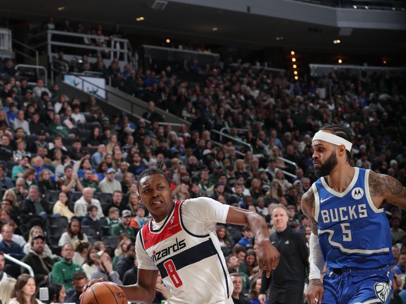 MILWAUKEE, WI - NOVEMBER 30: Bub Carrington #8 of the Washington Wizards drives to the basket during the game against the Milwaukee Bucks on November 30, 2024 at Fiserv Forum Center in Milwaukee, Wisconsin. NOTE TO USER: User expressly acknowledges and agrees that, by downloading and or using this Photograph, user is consenting to the terms and conditions of the Getty Images License Agreement. Mandatory Copyright Notice: Copyright 2024 NBAE (Photo by Gary Dineen/NBAE via Getty Images).