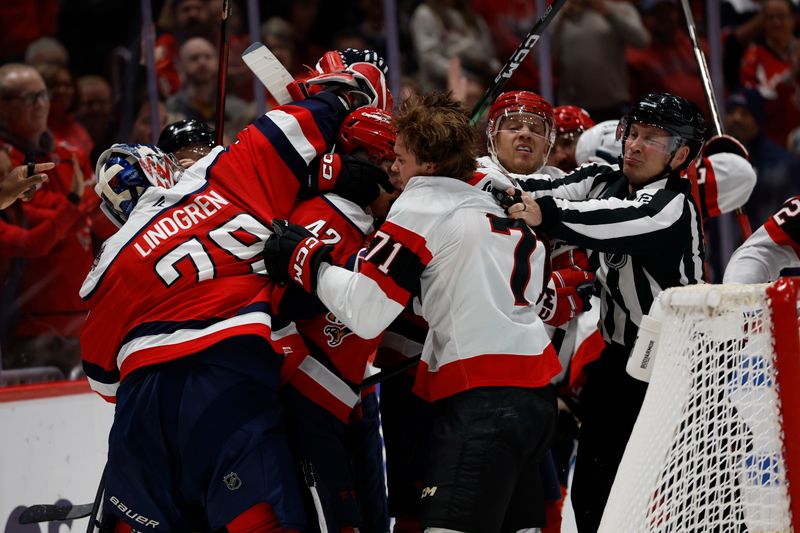 Oct 25, 2025; Washington, District of Columbia, USA; Washington Capitals goaltender Charlie Lindgren (79) gets involved in a scrum with Ottawa Senators center Ridly Greig (71) during the second period at Capital One Arena. Mandatory Credit: Geoff Burke-Imagn Images