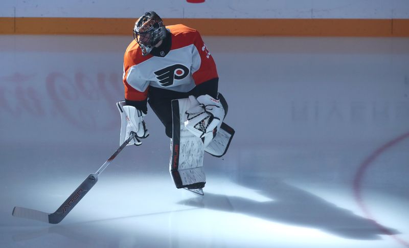 Feb 27, 2025; Pittsburgh, Pennsylvania, USA;  Philadelphia Flyers goaltender Samuel Ersson (33) takes the ice against the Pittsburgh Penguins at PPG Paints Arena. Mandatory Credit: Charles LeClaire-Imagn Images