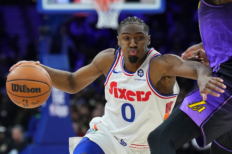 PHILADELPHIA, PENNSYLVANIA - JANUARY 28: Tyrese Maxey #0 of the Philadelphia 76ers dribbles the ball against the Los Angeles Lakers in the second half at the Wells Fargo Center on January 28, 2025 in Philadelphia, Pennsylvania. The 76ers defeated the Lakers 118-104. NOTE TO USER: User expressly acknowledges and agrees that, by downloading and/or using this photograph, user is consenting to the terms and conditions of the Getty Images License Agreement. (Photo by Mitchell Leff/Getty Images)