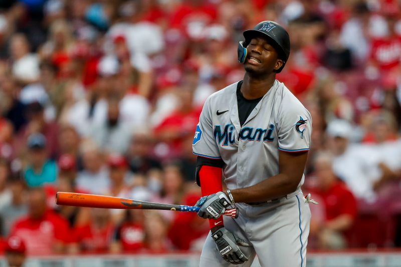 Aug 8, 2023; Cincinnati, Ohio, USA; Miami Marlins right fielder Jesus Sanchez (7) reacts after striking out against the Cincinnati Reds in the fourth inning at Great American Ball Park. Mandatory Credit: Katie Stratman-USA TODAY Sports