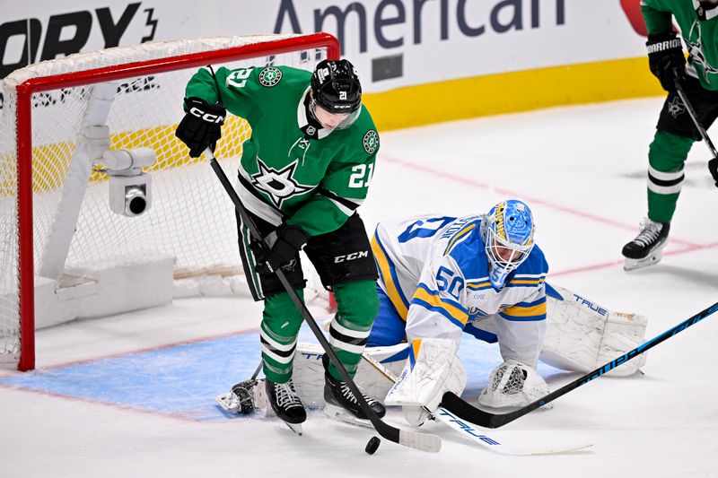 Feb 4, 2026; Dallas, Texas, USA; Dallas Stars left wing Jason Robertson (21) attempts to poke the puck past St. Louis Blues goaltender Jordan Binnington (50) during the first period at the American Airlines Center. Mandatory Credit: Jerome Miron-Imagn Images