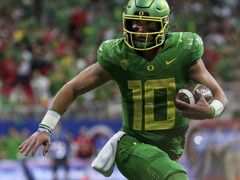 Sep 3, 2022; Atlanta, Georgia, USA; Oregon Ducks quarterback Bo Nix (10) runs the ball against the Georgia Bulldogs in the second quarter at Mercedes-Benz Stadium. Mandatory Credit: Brett Davis-USA TODAY Sports