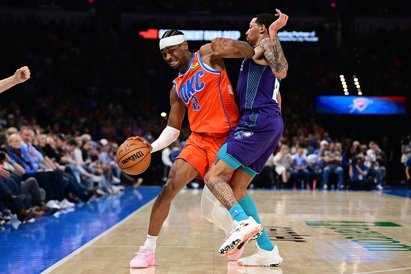 OKLAHOMA CITY, OKLAHOMA - FEBRUARY 2: Shai Gilgeous-Alexander #2 of the Oklahoma City Thunder attempts to drive past Nick Smith Jr. #8 of the Charlotte Hornets during the second half at Paycom Center on February 2, 2024 in Oklahoma City, Oklahoma. NOTE TO USER: User expressly acknowledges and agrees that, by downloading and or using this Photograph, user is consenting to the terms and conditions of the Getty Images License Agreement. (Photo by Joshua Gateley/Getty Images)