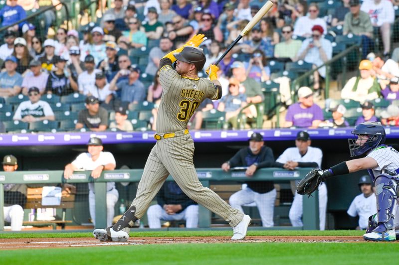 May 10, 2025; Denver, Colorado, USA; San Diego Padres first base Gavin Sheets (30) hits a home run in the first inning against the Colorado Rockies at Coors Field. Mandatory Credit: John Leyba-Imagn Images