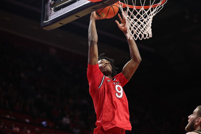 Dec 2, 2025; Piscataway, New Jersey, USA; Rutgers Scarlet Knights forward Dylan Grant (9) goes up for a dunk during the second half against the Purdue Boilermakers at Jersey Mike's Arena. Mandatory Credit: Vincent Carchietta-Imagn Images