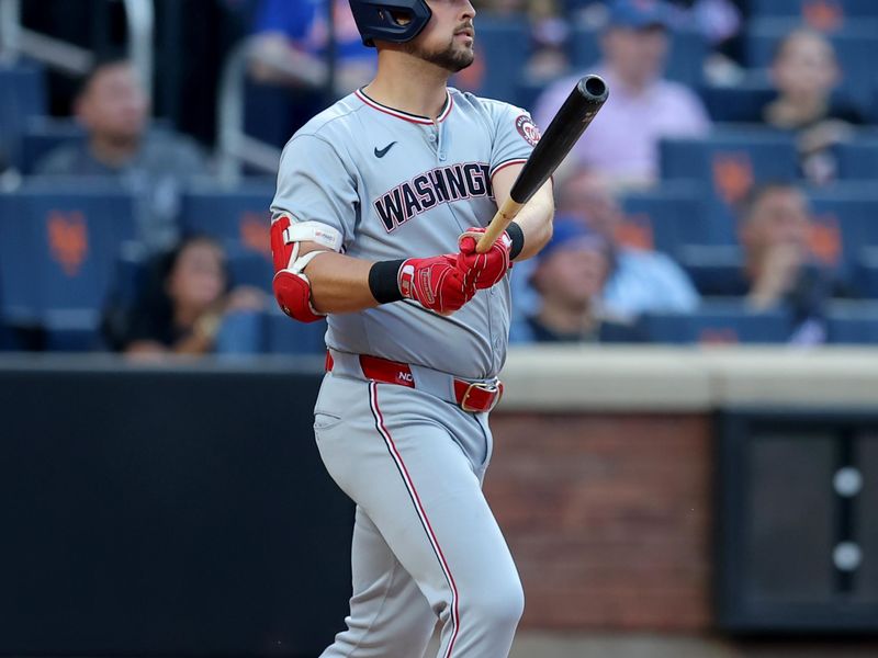 Jun 10, 2025; New York City, New York, USA; Washington Nationals first baseman Nathaniel Lowe (33) watches his two run home run against the New York Mets during the first inning at Citi Field. Mandatory Credit: Brad Penner-Imagn Images