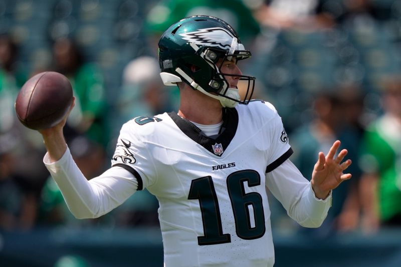 Philadelphia Eagles quarterback Tanner McKee (16) warms up before a preseason NFL football game against the Minnesota Vikings on Saturday, Aug. 24, 2024, in Philadelphia. (AP Photo/Matt Slocum)