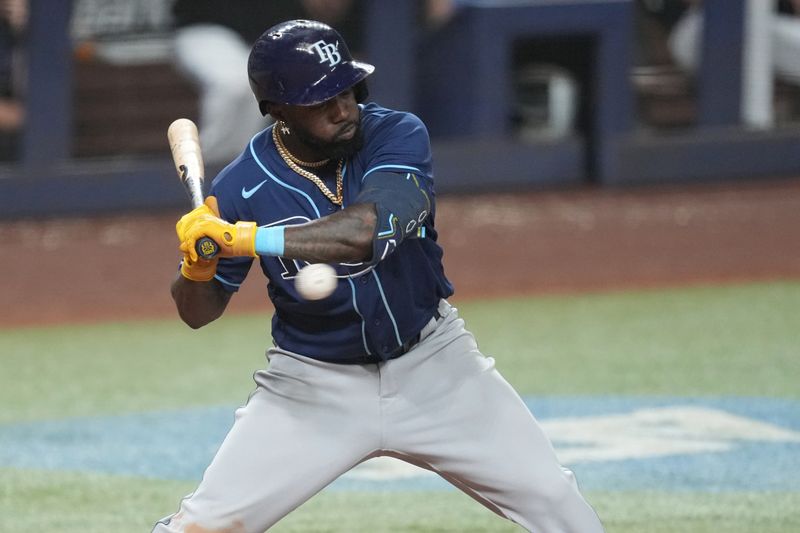 Aug 30, 2023; Miami, Florida, USA; Tampa Bay Rays left fielder Randy Arozarena (56) gets hit by a pitch in the eighth inning against the Miami Marlins at loanDepot Park. Mandatory Credit: Jim Rassol-USA TODAY Sports