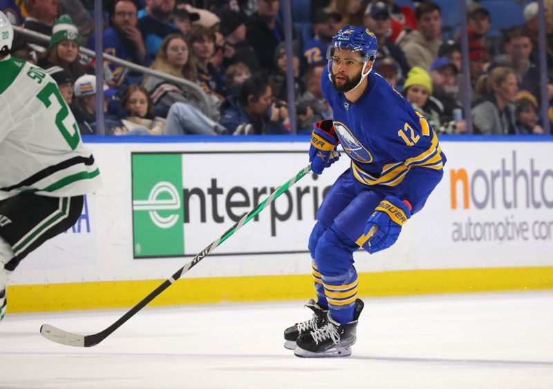 Mar 9, 2023; Buffalo, New York, USA;  Buffalo Sabres left wing Jordan Greenway (12) looks for the puck during the second period against the Dallas Stars at KeyBank Center. Mandatory Credit: Timothy T. Ludwig-USA TODAY Sports