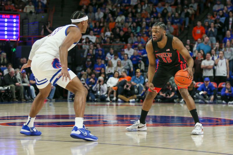 Feb 19, 2023; Boise, Idaho, USA; UNLV Rebels guard EJ Harkless (55) dribbles against Boise State Broncos guard Chibuzo Agbo (11) during the first half at ExtraMile Arena. Mandatory Credit: Brian Losness-USA TODAY Sports
