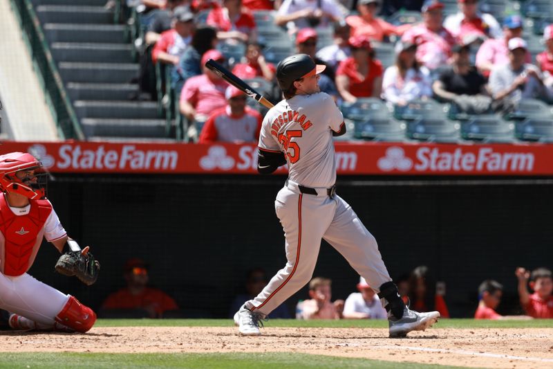 Apr 24, 2024; Anaheim, California, USA;  Baltimore Orioles designated hitter Adley Rutschman (35) hits an RBI single during the fifth inning against the Los Angeles Angels at Angel Stadium. Mandatory Credit: Kiyoshi Mio-USA TODAY Sports