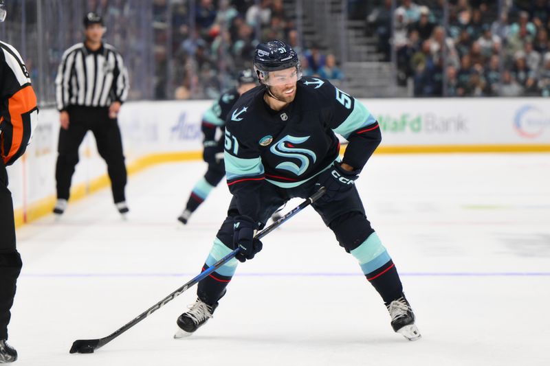 Oct 2, 2024; Seattle, Washington, USA; Seattle Kraken center Shane Wright (51) advances the puck against the Edmonton Oilers during the first period at Climate Pledge Arena. Mandatory Credit: Steven Bisig-Imagn Images