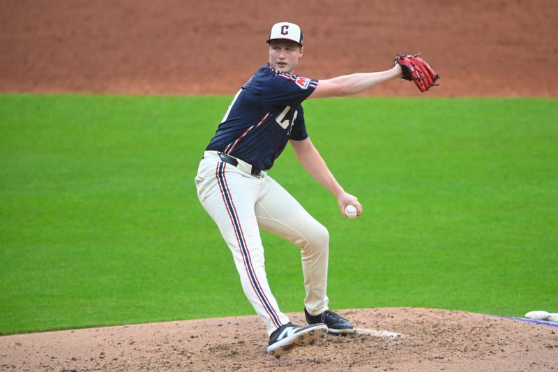 Jun 18, 2024; Cleveland, Ohio, USA; Cleveland Guardians relief pitcher Tim Herrin (29) delivers a pitch in the third inning against the Seattle Mariners at Progressive Field. Mandatory Credit: David Richard-USA TODAY Sports