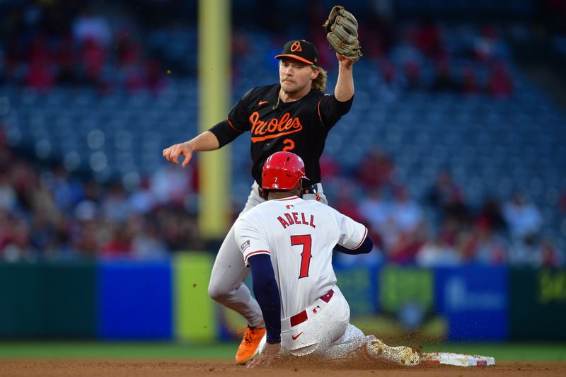 Apr 23, 2024; Anaheim, California, USA; Los Angeles Angels right fielder Jo Adell (7) is caught stealing second against Baltimore Orioles shortstop Gunnar Henderson (2) during the third inning at Angel Stadium. Mandatory Credit: Gary A. Vasquez-USA TODAY Sports
