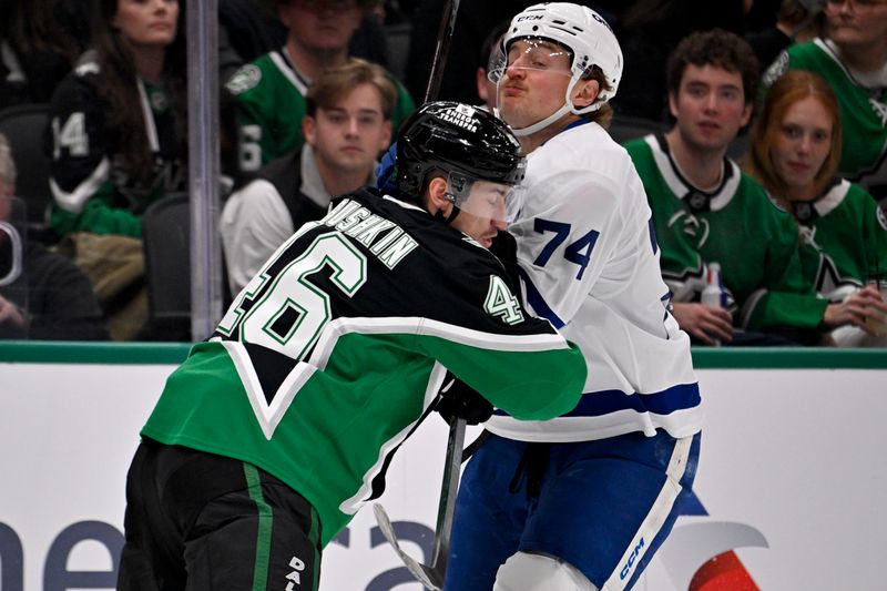 Dec 21, 2025; Dallas, Texas, USA; Dallas Stars defenseman Ilya Lyubushkin (46) checks Toronto Maple Leafs center Bobby McMann (74) during the first period at the American Airlines Center. Mandatory Credit: Jerome Miron-Imagn Images