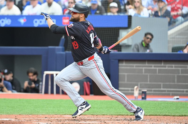 May 12, 2024; Toronto, Ontario, CAN;  Minnesota Twins left fielder Alex Kirilloff (19) hits an infield hit against the Toronto Blue Jays in the seventh inning at Rogers Centre. Mandatory Credit: Dan Hamilton-USA TODAY Sports