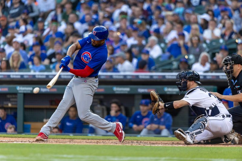 Aug 22, 2023; Detroit, Michigan, USA; Chicago Cubs third baseman Jeimer Candelario (9) hits the ball in the second inning against the Detroit Tigers at Comerica Park. Mandatory Credit: David Reginek-USA TODAY Sports