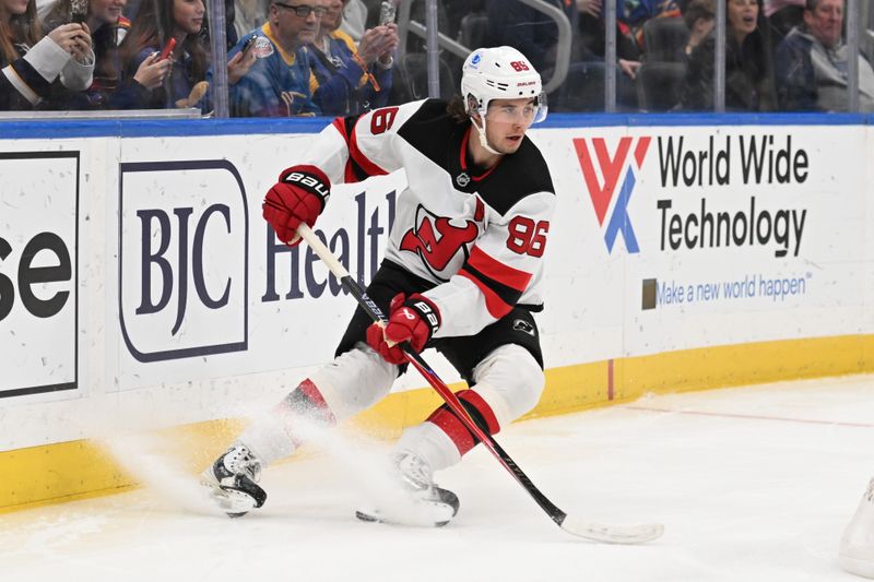 Feb 28, 2026; St. Louis, Missouri, USA; New Jersey Devils center Jack Hughes (86) controls the puck against the St. Louis Blues in the first period at Enterprise Center. Mandatory Credit: Joe Puetz-Imagn Images