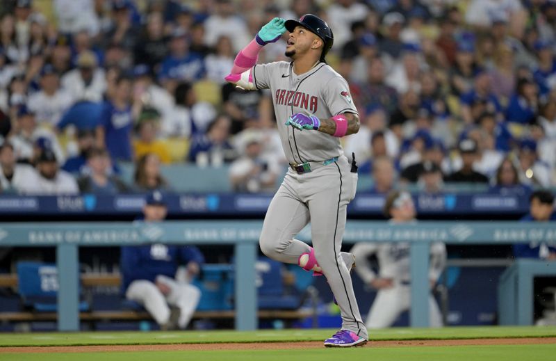 May 21, 2025; Los Angeles, California, USA; Arizona Diamondbacks second baseman Ketel Marte (4) reacts after hitting a home run during the fourth inning against the Los Angeles Dodgers at Dodger Stadium. Mandatory Credit: Jayne Kamin-Oncea-Imagn Images