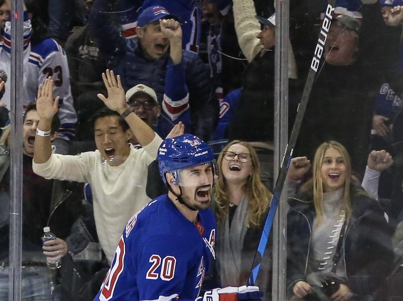 Nov 12, 2023; New York, New York, USA;  New York Rangers left wing Chris Kreider (20) celebrates after making an assist on a game tying goal in the third period against the Columbus Blue Jackets at Madison Square Garden. Mandatory Credit: Wendell Cruz-USA TODAY Sports