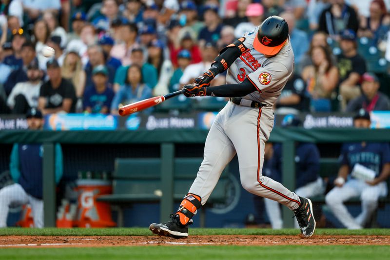 Jul 3, 2024; Seattle, Washington, USA; Baltimore Orioles first baseman Ryan O'Hearn (32) hits a solo-home run against the Seattle Mariners during the fifth inning at T-Mobile Park. Mandatory Credit: Joe Nicholson-USA TODAY Sports