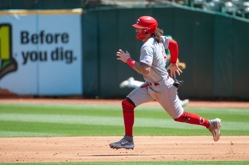 Apr 29, 2023; Oakland, California, USA; Cincinnati Reds second baseman Jonathan India (6) advances on a throwing error during the third inning at RingCentral Coliseum. Mandatory Credit: Ed Szczepanski-USA TODAY Sports