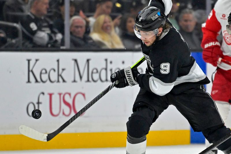 Nov 16, 2024; Los Angeles, California, USA;  Los Angeles Kings right wing Adrian Kempe (9) handles the puck against the Detroit Red Wings at Crypto.com Arena. Mandatory Credit: Jayne Kamin-Oncea-Imagn Images