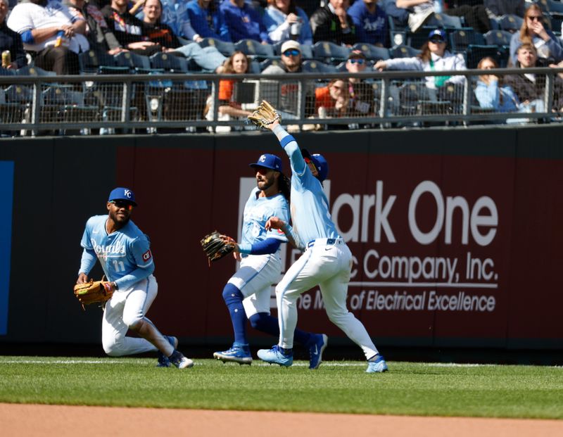 Apr 6, 2025; Kansas City, Missouri, USA; Kansas City Royals third base Maikel Garcia (11) Kansas City Royals shortstop Bobby Witt Jr. (7) and Kansas City Royals second base Jonathan India (6) merge on a pop fly at Kauffman Stadium. Mandatory Credit: Gary Rohman-Imagn Images