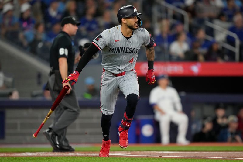 May 10, 2024; Toronto, Ontario, CAN; Minnesota Twins shortstop Carlos Correa (4) runs to first base on a single against the Toronto Blue Jays during the first inning at Rogers Centre. Mandatory Credit: John E. Sokolowski-USA TODAY Sports