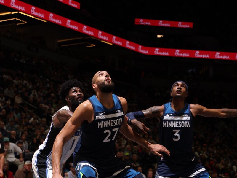 MINNEAPOLIS, MN -  FEBRUARY 2: Rudy Gobert #27 and Jaden McDaniels #3 of the Minnesota Timberwolves box out against Jonathan Isaac #1 of the Orlando Magic during the game on February 2, 2024 at Target Center in Minneapolis, Minnesota. NOTE TO USER: User expressly acknowledges and agrees that, by downloading and or using this Photograph, user is consenting to the terms and conditions of the Getty Images License Agreement. Mandatory Copyright Notice: Copyright 2024 NBAE (Photo by David Sherman/NBAE via Getty Images)