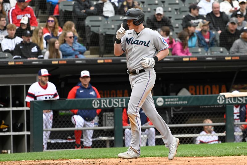 Jun 11, 2023; Chicago, Illinois, USA;  Miami Marlins first baseman Garrett Cooper (26) after he hits a home run against the Chicago White Sox during the eighth inning at Guaranteed Rate Field. Mandatory Credit: Matt Marton-USA TODAY Sports