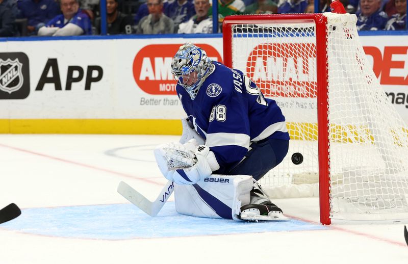 Oct 24, 2024; Tampa, Florida, USA; Tampa Bay Lightning goaltender Andrei Vasilevskiy (88) misses the puck for a goal as Minnesota Wild center Joel Eriksson Ek (14) (not pictured) scored as goal during the second period at Amalie Arena. Mandatory Credit: Kim Klement Neitzel-Imagn Images