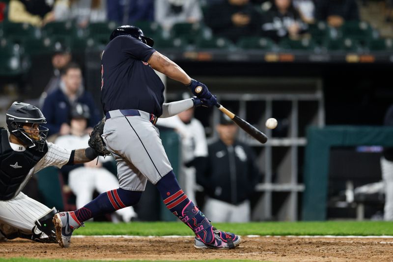 May 9, 2024; Chicago, Illinois, USA; Cleveland Guardians first base Josh Naylor (22) hits a solo home run against the Chicago White Sox during the eight inning at Guaranteed Rate Field. Mandatory Credit: Kamil Krzaczynski-USA TODAY Sports