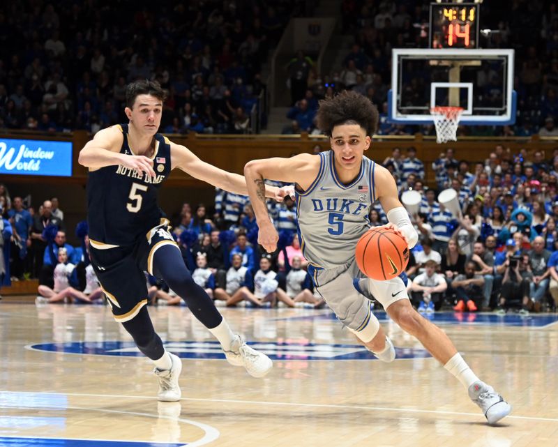 Feb 14, 2023; Durham, North Carolina, USA;  Duke Blue Devils guard Tyrese Proctor(5) drives to the basket  as Notre Dame Fighting Irish guard Cormac Ryan (5) defends during the second half at Cameron Indoor Stadium.  The Blue Devils won 68-64. Mandatory Credit: Rob Kinnan-USA TODAY Sports