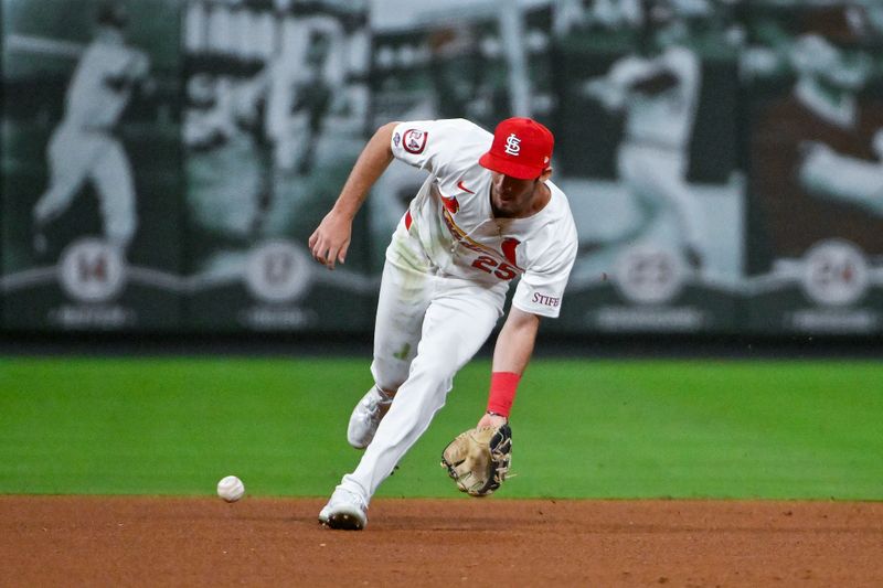 Sep 10, 2024; St. Louis, Missouri, USA;  St. Louis Cardinals shortstop Thomas Saggese (25) fields a ground ball in his Major League debut during the seventh inning against the Cincinnati Reds at Busch Stadium. Mandatory Credit: Jeff Curry-Imagn Images