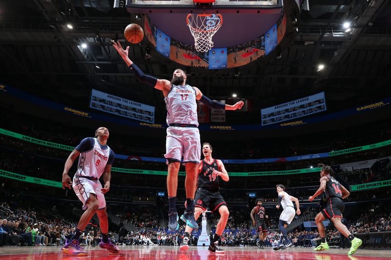 WASHINGTON, DC -?JANUARY 29: Jonas Valanciunas #17 of the Washington Wizards rebounds during the game against the Toronto Raptors on January 29, 2025 at Capital One Arena in Washington, DC. NOTE TO USER: User expressly acknowledges and agrees that, by downloading and or using this Photograph, user is consenting to the terms and conditions of the Getty Images License Agreement. Mandatory Copyright Notice: Copyright 2025 NBAE (Photo by Stephen Gosling/NBAE via Getty Images)