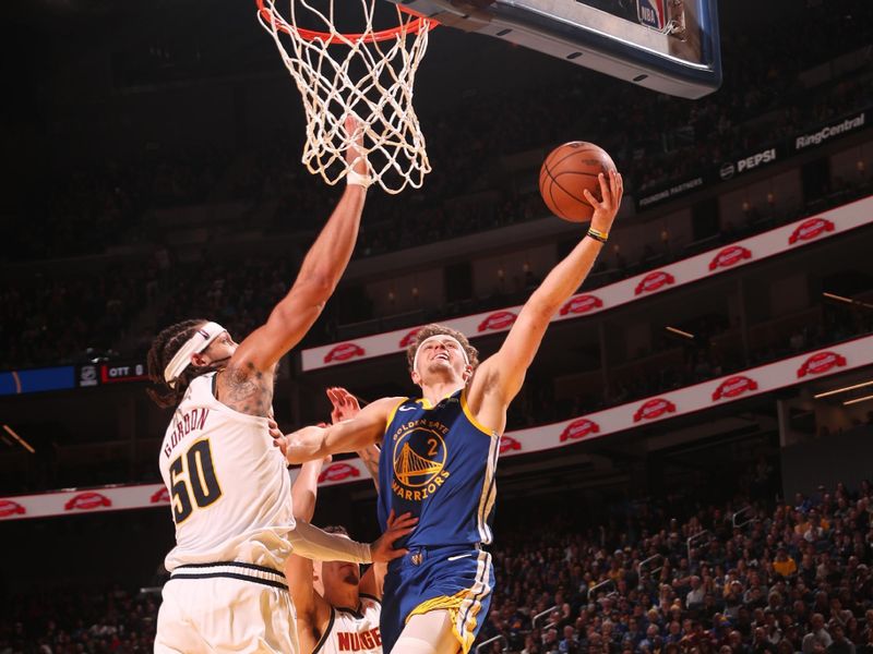 SAN FRANCISCO, CA - JANUARY 4: Brandin Podziemski #2 of the Golden State Warriors drives to the basket during the game against the Denver Nuggets on January 4, 2024 at Chase Center in San Francisco, California. NOTE TO USER: User expressly acknowledges and agrees that, by downloading and or using this photograph, user is consenting to the terms and conditions of Getty Images License Agreement. Mandatory Copyright Notice: Copyright 2024 NBAE (Photo by Jed Jacobsohn/NBAE via Getty Images)