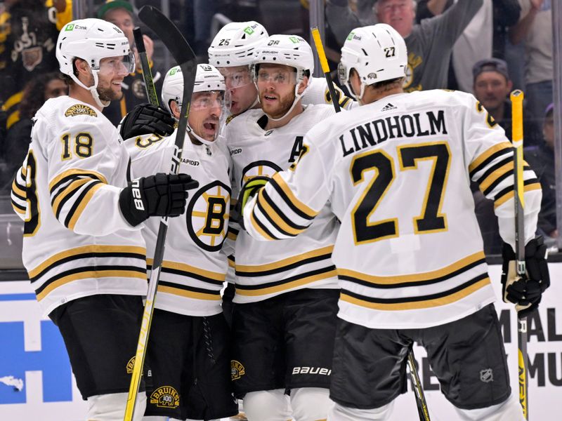 Oct 21, 2023; Los Angeles, California, USA; Boston Bruins left wing Brad Marchand (second from left) celebrates with teammates after scoring against the Los Angeles Kings during the third period at Crypto.com Arena. Mandatory Credit: Alex Gallardo-USA TODAY Sports