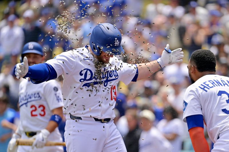 Apr 30, 2025; Los Angeles, California, USA; Los Angeles Dodgers third base Max Muncy (13) is congratulated by Los Angeles Dodgers right fielder Teoscar Hernandez (37) after hitting a home run against the Miami Marlins at Dodger Stadium. Mandatory Credit: Jayne Kamin-Oncea-Imagn Images