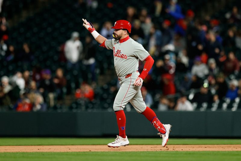 May 19, 2025; Denver, Colorado, USA; Philadelphia Phillies designated hitter Kyle Schwarber (12) gestures as he rounds the bases on a solo home run in the ninth inning against the Colorado Rockies at Coors Field. Mandatory Credit: Isaiah J. Downing-Imagn Images