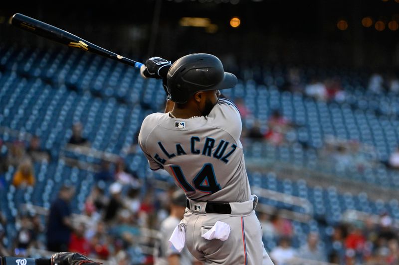 Aug 31, 2023; Washington, District of Columbia, USA; Miami Marlins left fielder Bryan De La Cruz (14) hits a RBI double against the Washington Nationals during the first inning  at Nationals Park. Mandatory Credit: Brad Mills-USA TODAY Sports