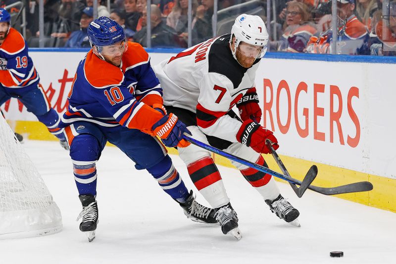 Nov 4, 2024; Edmonton, Alberta, CAN; Edmonton Oilers forward Derek Ryan (10) and New Jersey Devils defensemen Dougie Hamilton (7) battle during the third period at Rogers Place. Mandatory Credit: Perry Nelson-Imagn Images