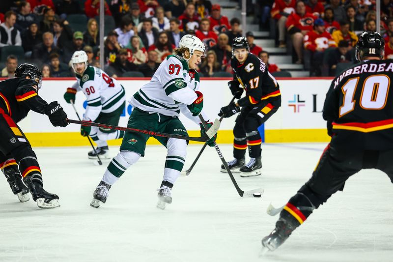 Dec 4, 2025; Calgary, Alberta, CAN; Minnesota Wild left wing Kirill Kaprizov (97) controls the puck against the Calgary Flames during the third period at Scotiabank Saddledome. Mandatory Credit: Sergei Belski-Imagn Images
