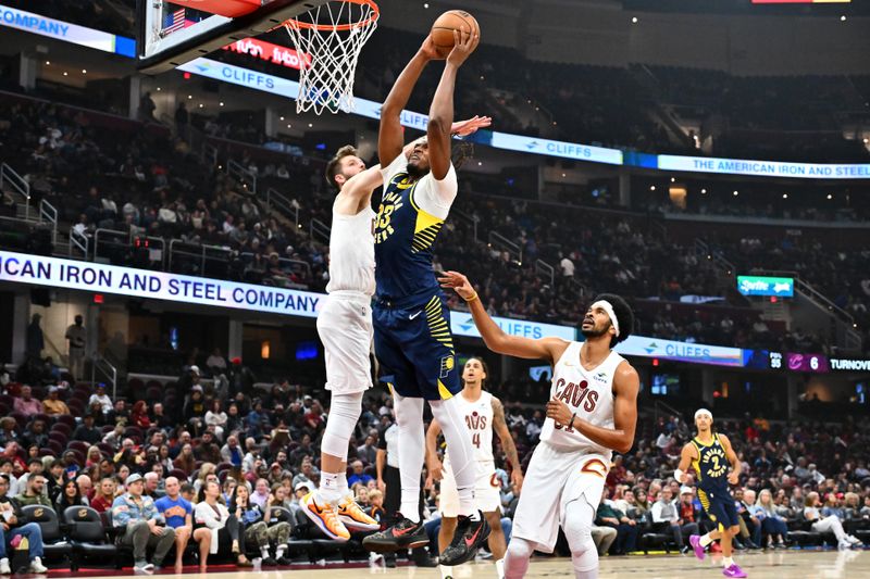 CLEVELAND, OHIO - OCTOBER 10: Myles Turner #33 of the Indiana Pacers dunks over Dean Wade #32 of the Cleveland Cavaliers during the first half of a preseason game at Rocket Mortgage Fieldhouse on October 10, 2024 in Cleveland, Ohio. NOTE TO USER: User expressly acknowledges and agrees that, by downloading and or using this photograph, User is consenting to the terms and conditions of the Getty Images License Agreement. (Photo by Jason Miller/Getty Images)