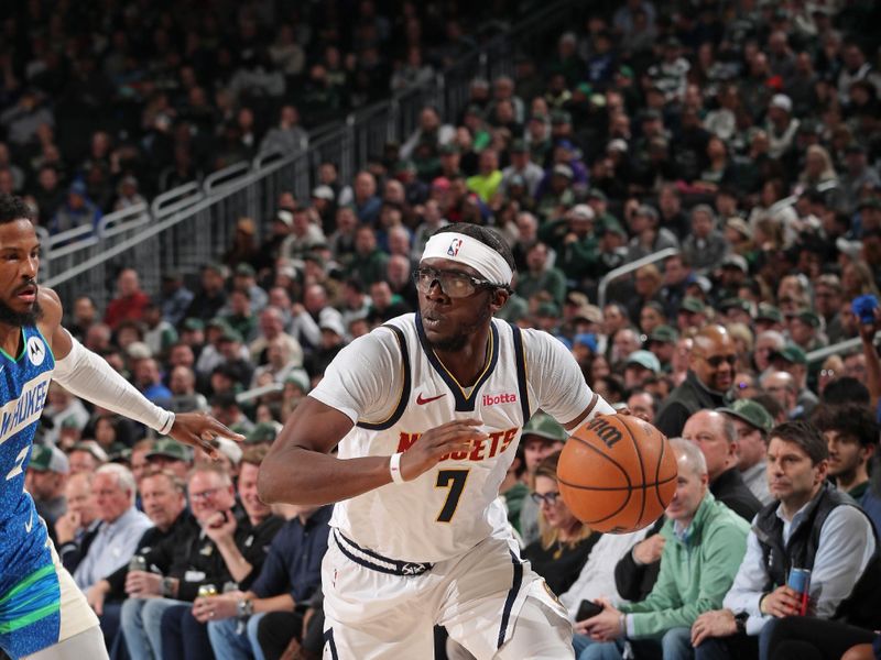 MILWAUKEE, WI - FEBRUARY 12: Reggie Jackson #7 of the Denver Nuggets looks on during the game against the Milwaukee Bucks on February 12, 2024 at the Fiserv Forum Center in Milwaukee, Wisconsin. NOTE TO USER: User expressly acknowledges and agrees that, by downloading and or using this Photograph, user is consenting to the terms and conditions of the Getty Images License Agreement. Mandatory Copyright Notice: Copyright 2024 NBAE (Photo by Gary Dineen/NBAE via Getty Images).