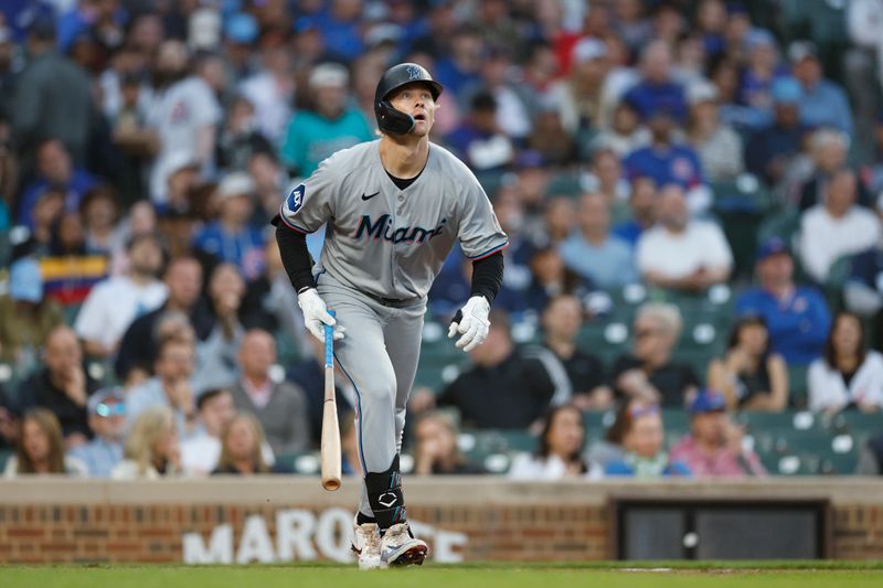 May 14, 2025; Chicago, Illinois, USA; Miami Marlins center fielder Kyle Stowers (28) watches his solo home run against the Chicago Cubs during the fourth inning at Wrigley Field. Mandatory Credit: Kamil Krzaczynski-Imagn Images