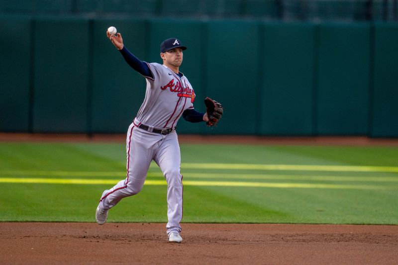 May 30, 2023; Oakland, California, USA;  Atlanta Braves third baseman Austin Riley (27) throws out Oakland Athletics center fielder Esteury Ruiz (not pictured) during the first inning at Oakland-Alameda County Coliseum. Mandatory Credit: Neville E. Guard-USA TODAY Sports