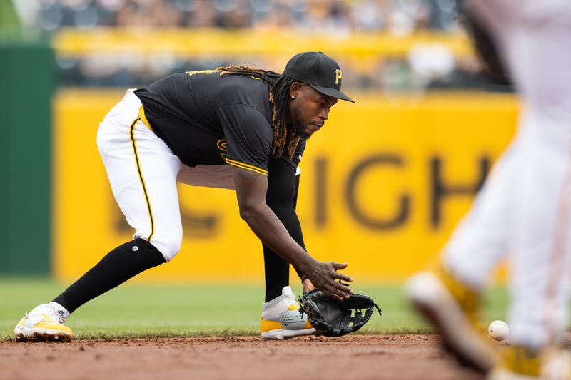 May 5, 2024; Pittsburgh, Pennsylvania, USA; Pittsburgh Pirates shortstop Oneil Cruz (15) fields a ground ball for the first out of the second inning against the Colorado Rockies at PNC Park. Mandatory Credit: Scott Galvin-USA TODAY Sports