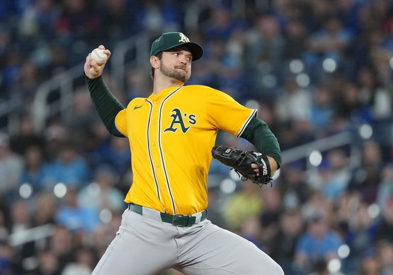 May 31, 2025; Toronto, Ontario, CAN; Athletics starting pitcher Gunnar Hoglund (53) throws a pitch against the Toronto Blue Jays during the first inning at Rogers Centre. Mandatory Credit: Nick Turchiaro-Imagn Images